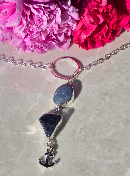 Sterling silver wrap necklace with bezel-set kyanite and marbled sodalite with hematite, finished with sand-casted anchor charm