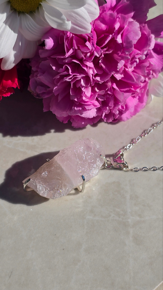 Sterling silver prong-set raw rose quartz pendant on 22 inch chain