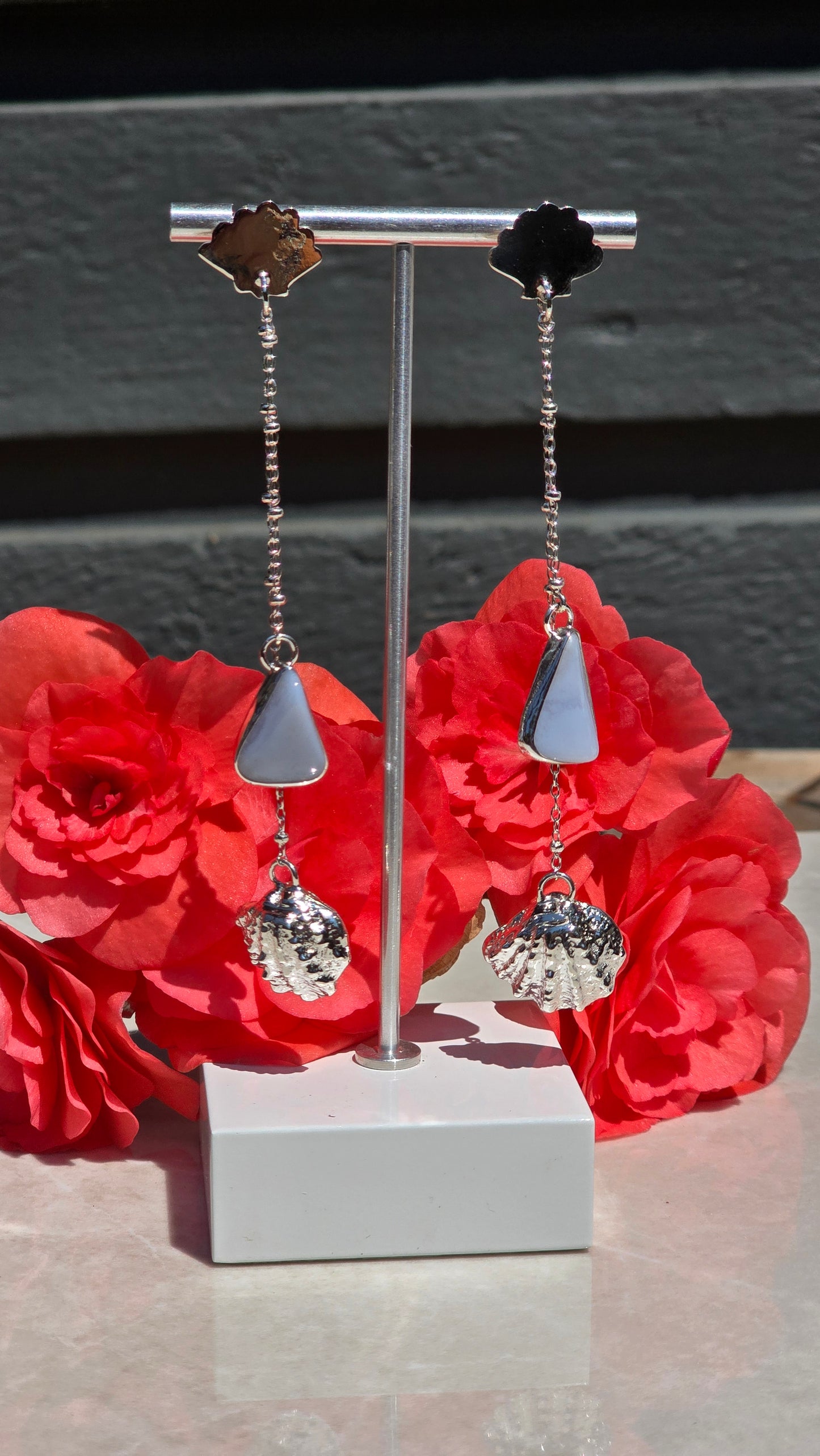 Sterling silver earrings with seashell stud, bezel-set blue lace agate, and dangling sandcasted seashell charm