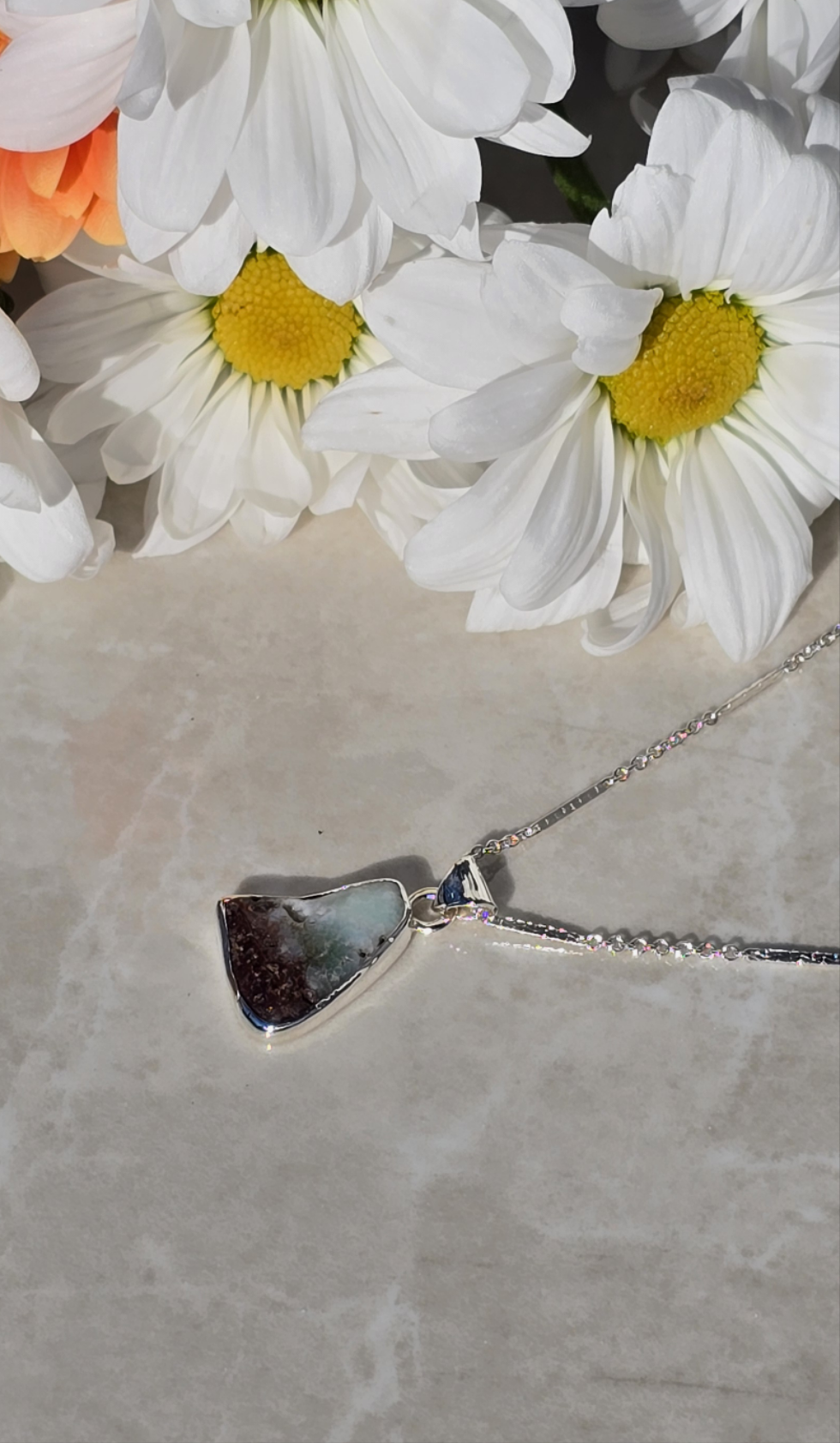 Sterling silver bezel-set chrysoprase pendant with natural brown and blue tones on 18 inch chain