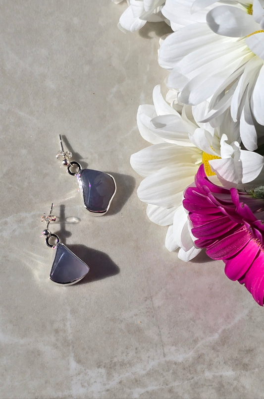 Sterling silver dangle earrings with bezel-set blue chalcedony in open back settings and ball stud tops