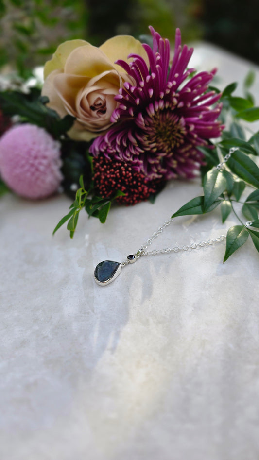 Sterling silver necklace with bezel-set tumbled moss agate and faceted black cubic zirconia on 17-inch chain