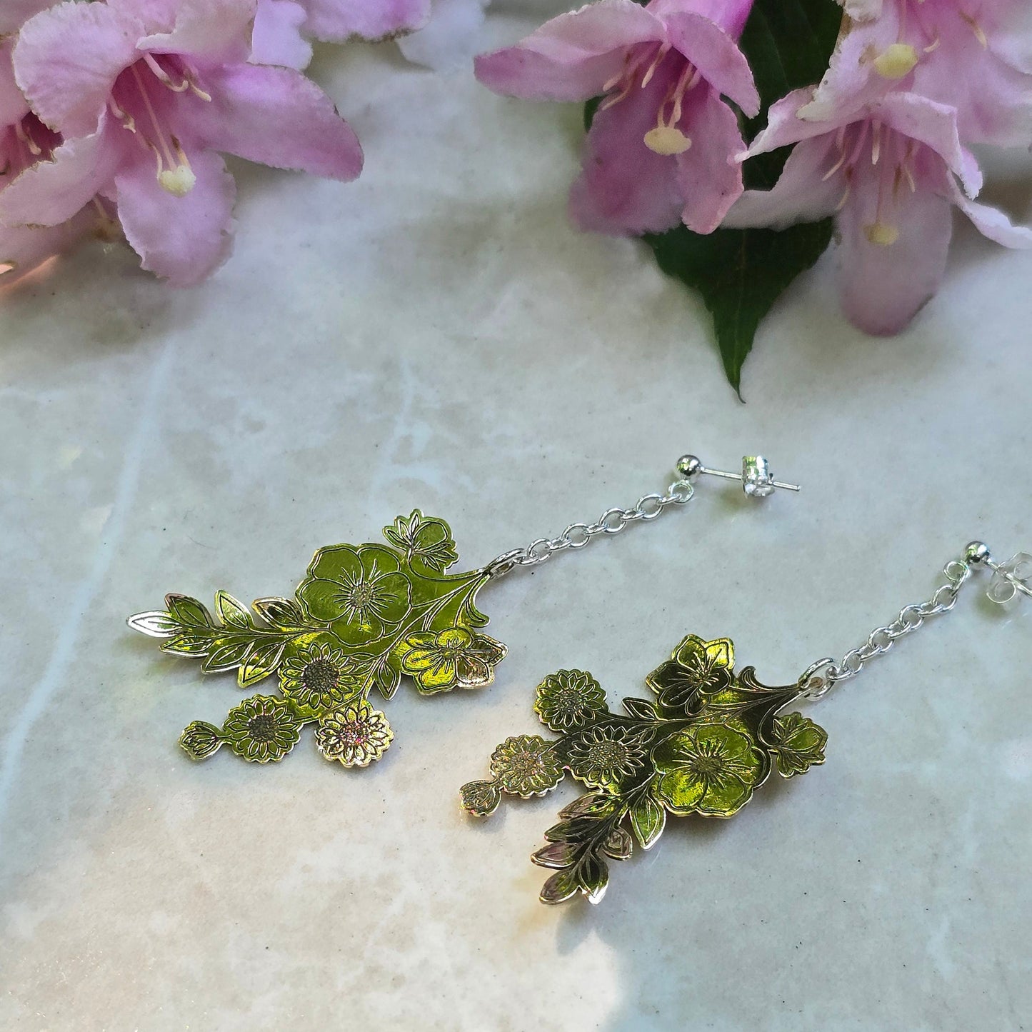 Handcrafted wildflower-inspired drop earrings featuring delicate floral elements with a lightweight, organic design that adds subtle movement and botanical elegance
