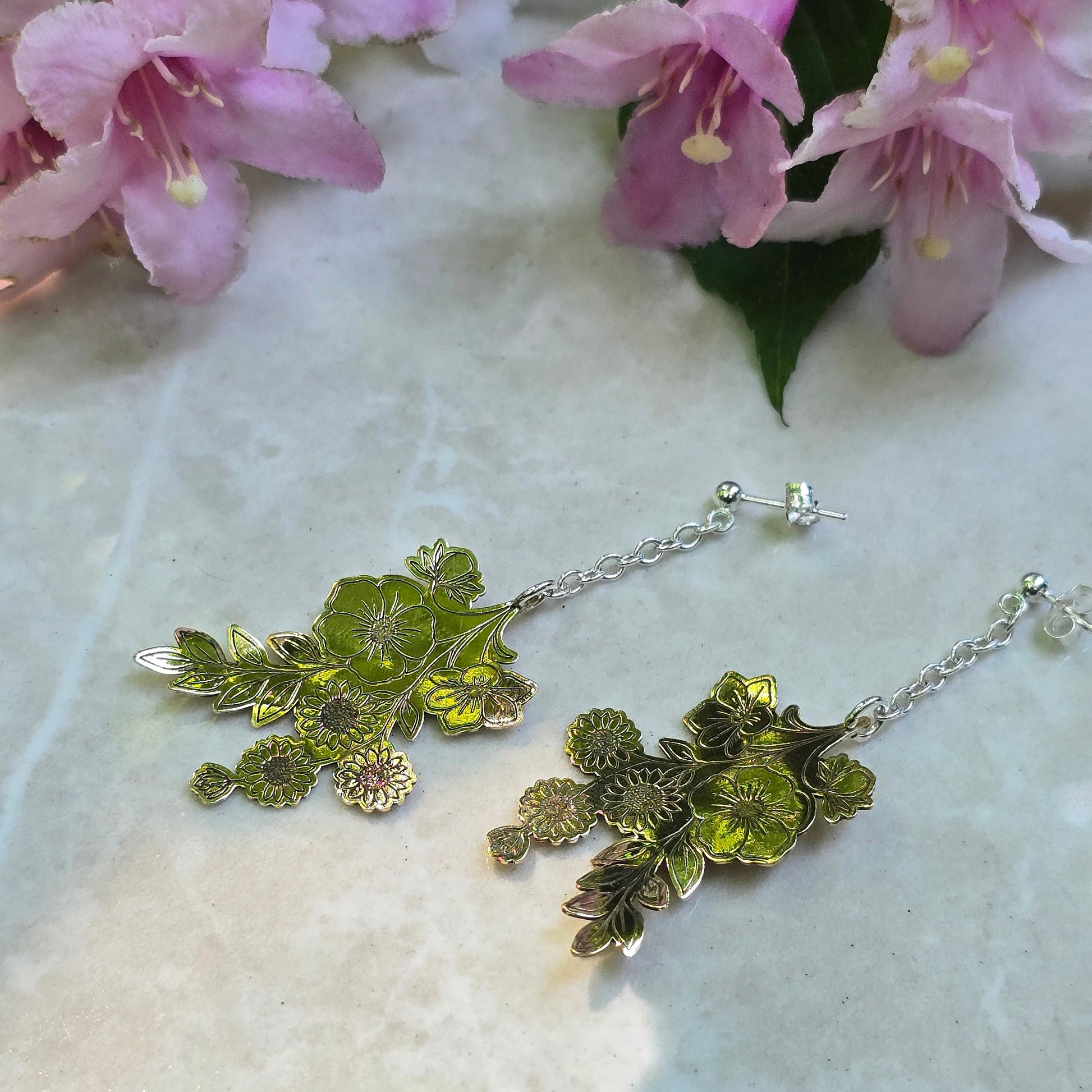 Handcrafted wildflower-inspired drop earrings featuring delicate floral elements with a lightweight, organic design that adds subtle movement and botanical elegance