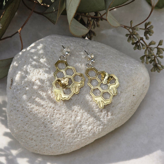 Honeycomb drop earrings with dripping honey detail and small bee accents, handmade nature-inspired jewelry in brass or sterling silver