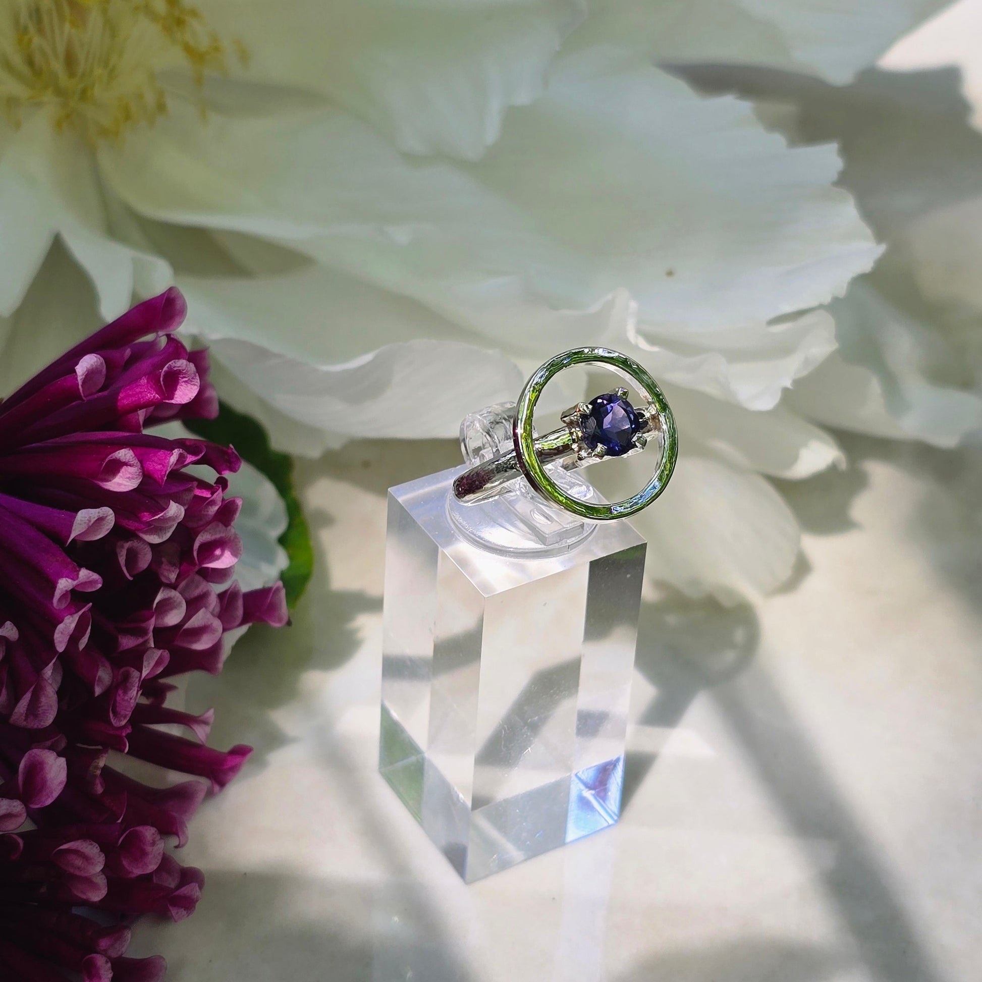 Sterling silver open circle ring with prong-set 6mm faceted iolite gemstone, minimalist moon-inspired ring in size 8.25